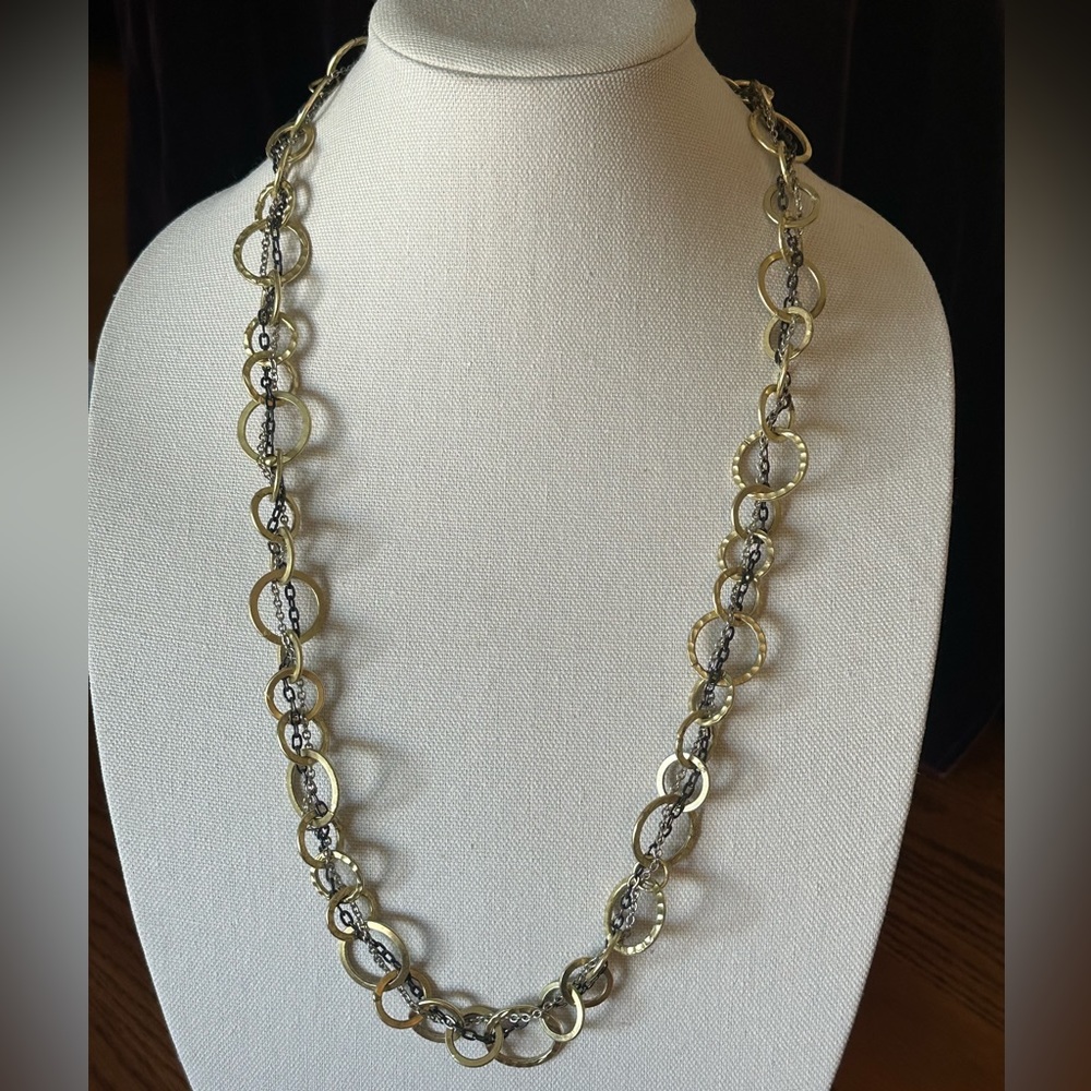 Necklace with tri-tone metals.